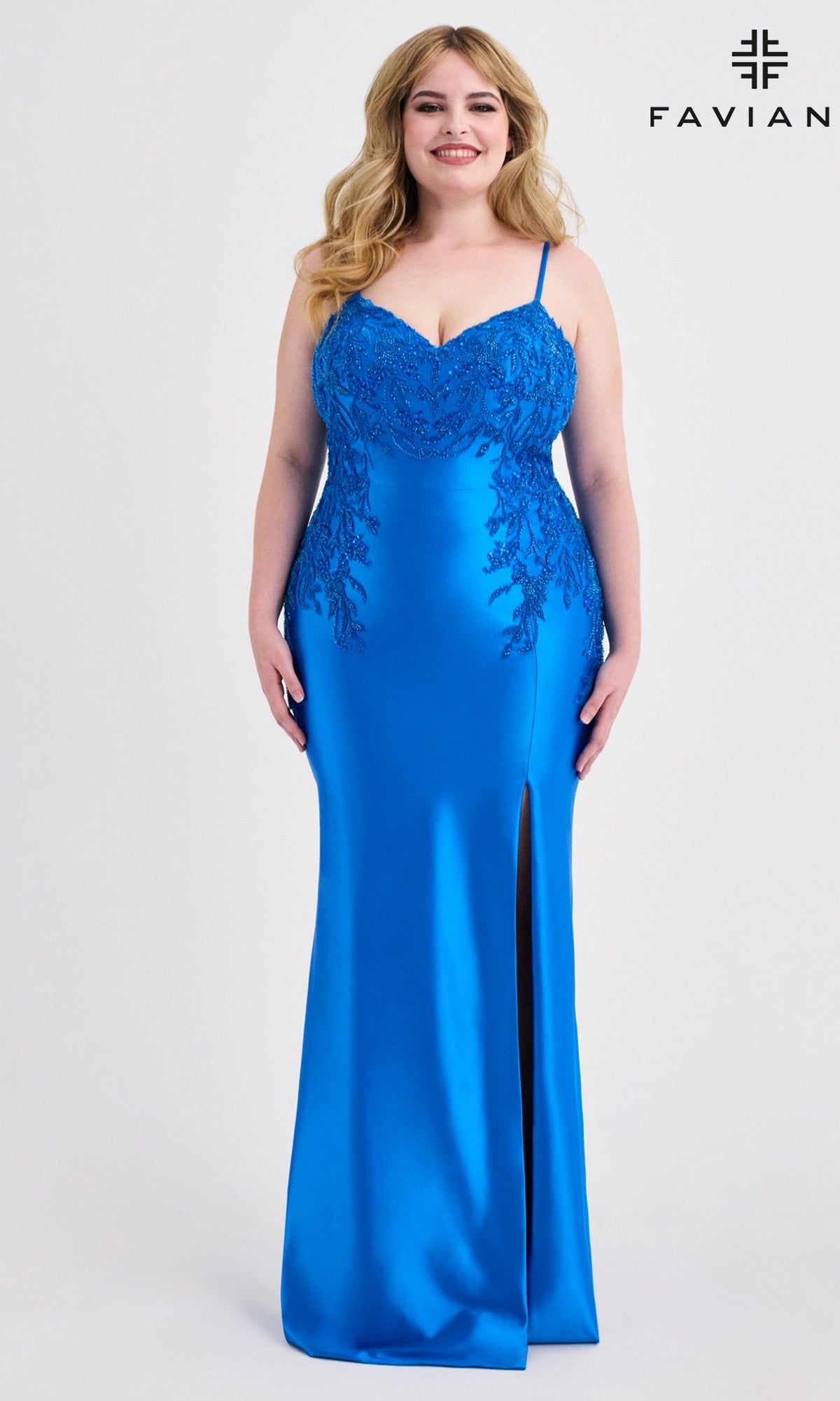 A woman wears the Plus-Size Lace-Up Long Prom Dress Faviana 9603 in Electric Blue, featuring a beaded lace bodice and thigh-high slit, standing against a plain white background with the FAVIANA logo in the top right corner.